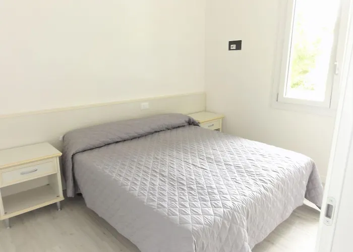 Апартаменты Bright Flat With Pool And Balcony Бибионе